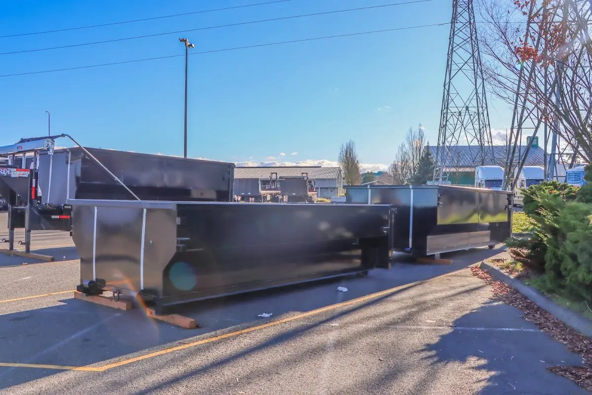 Roll-off dumpster ready for waste disposal at job site for 12 Yard Dumpster Rental in Hempstead